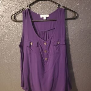 Purple sleeveless blouse with pockets